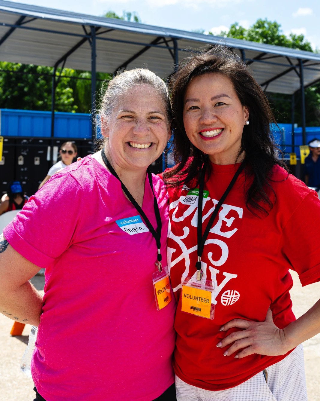 Volunteers smiling at Love Day, a BeHeard community event
